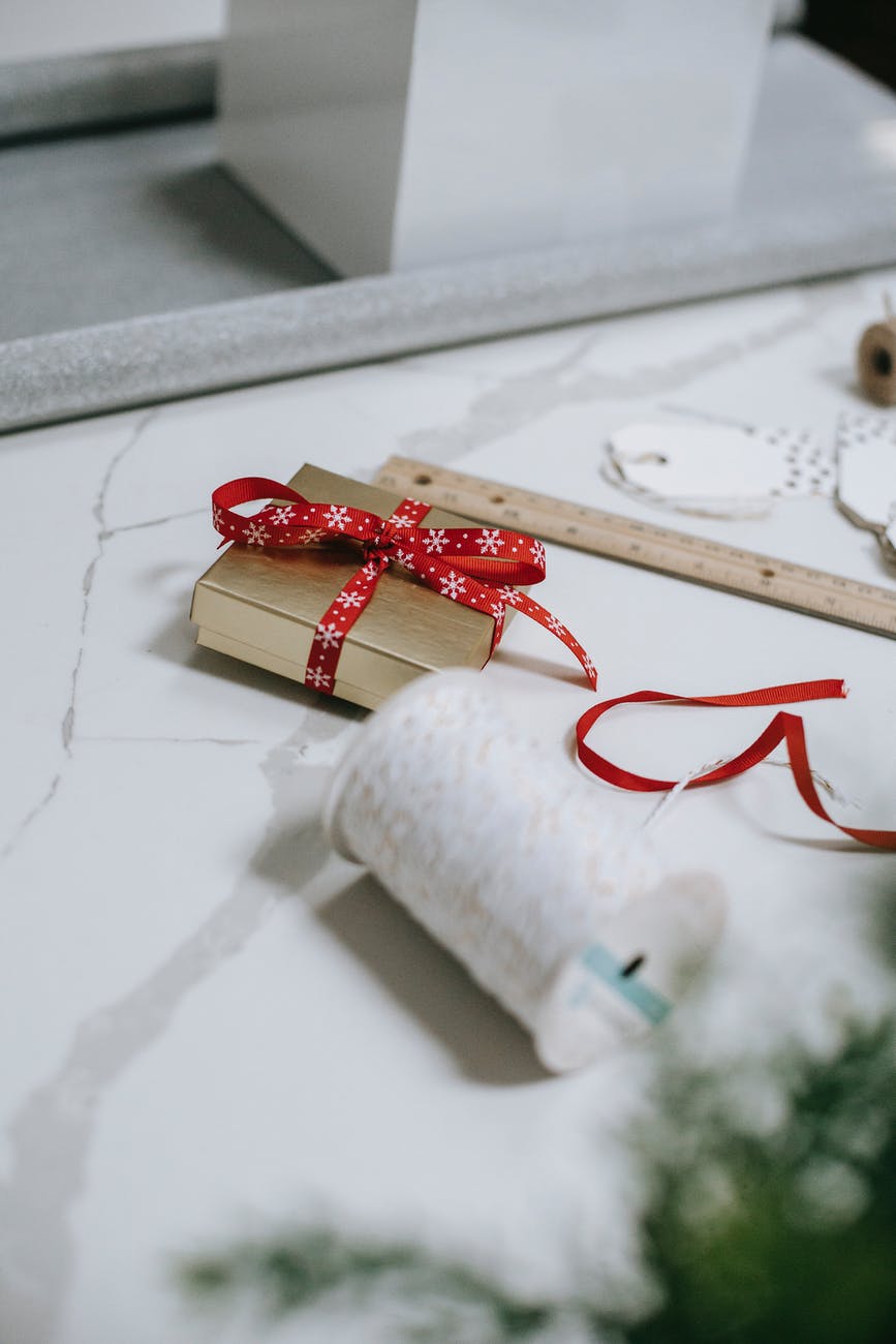 gift box with spool of thread and ruler