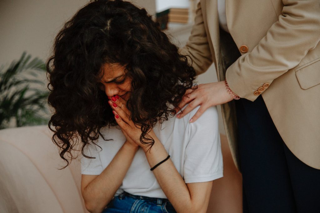 therapist comforting patient