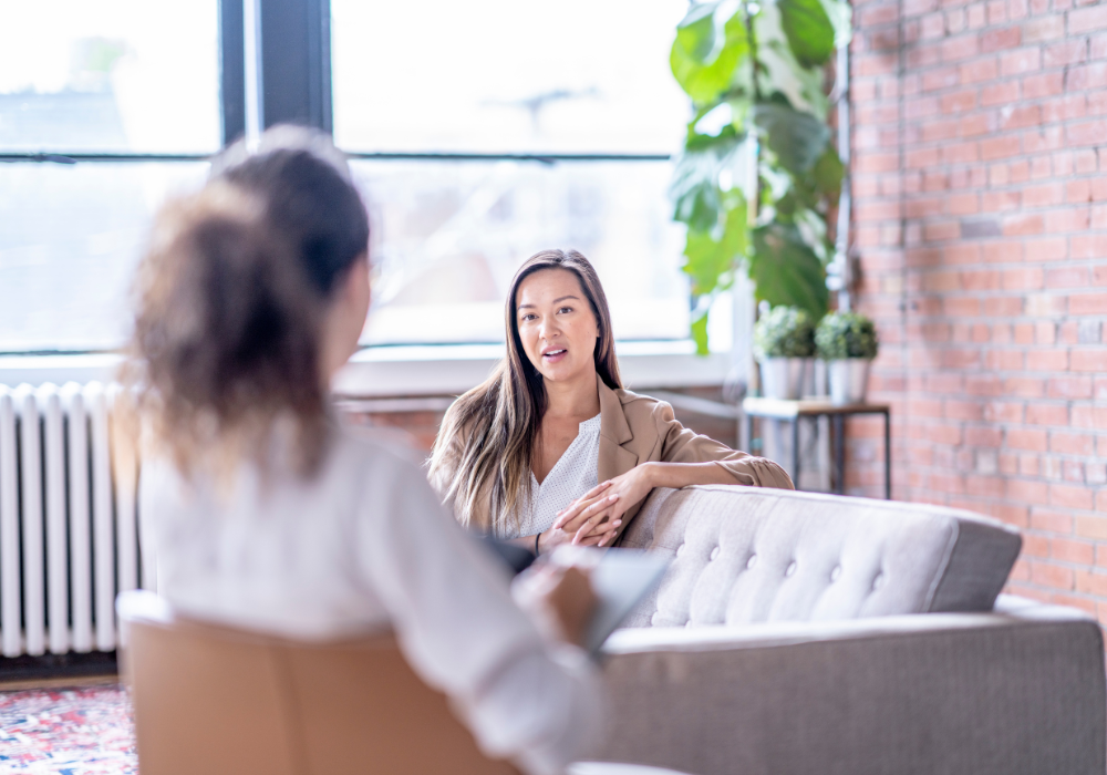 Therapist guiding a client through psychodynamic therapy techniques in a calm, supportive setting